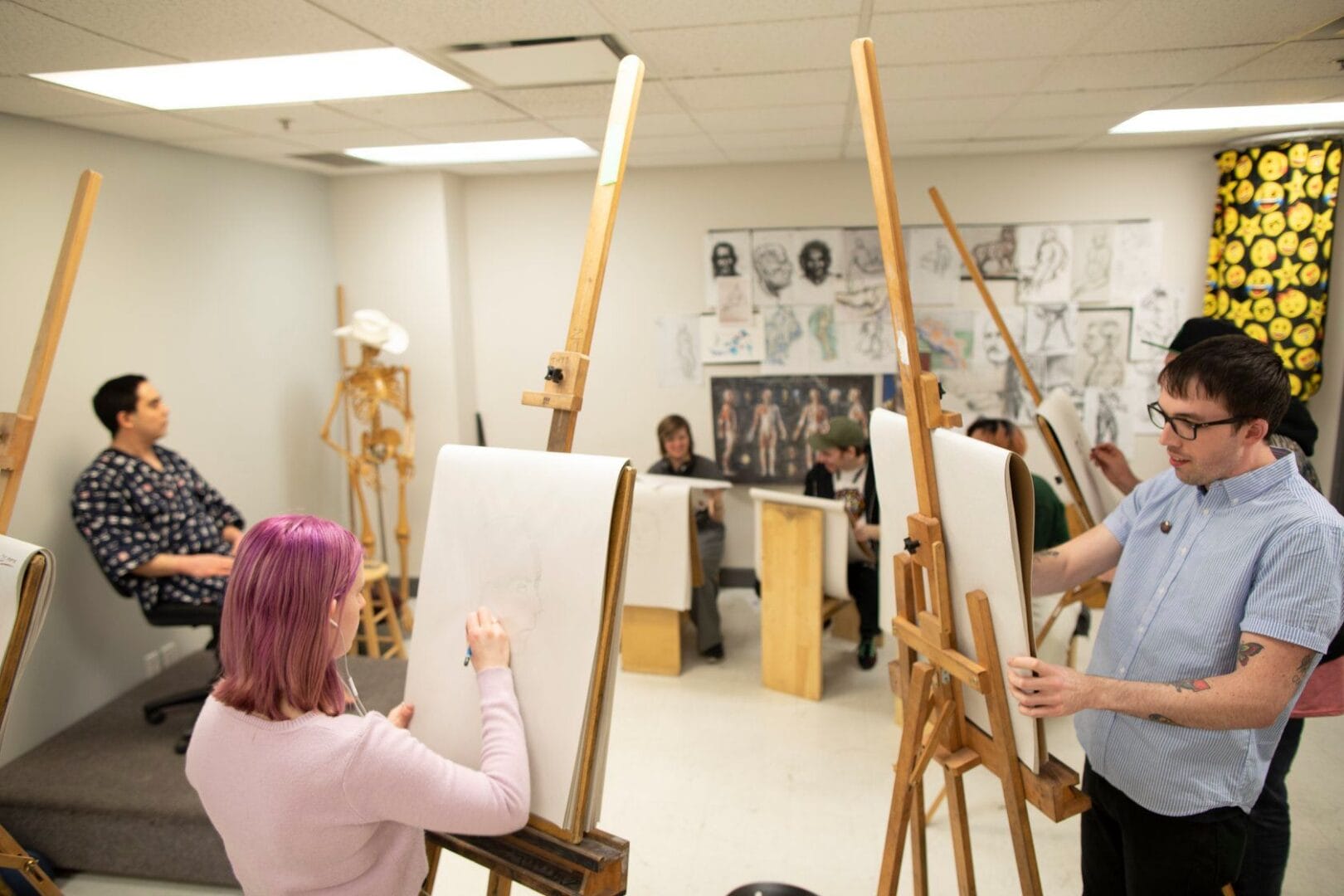 Animation students learning life drawing with a model.  