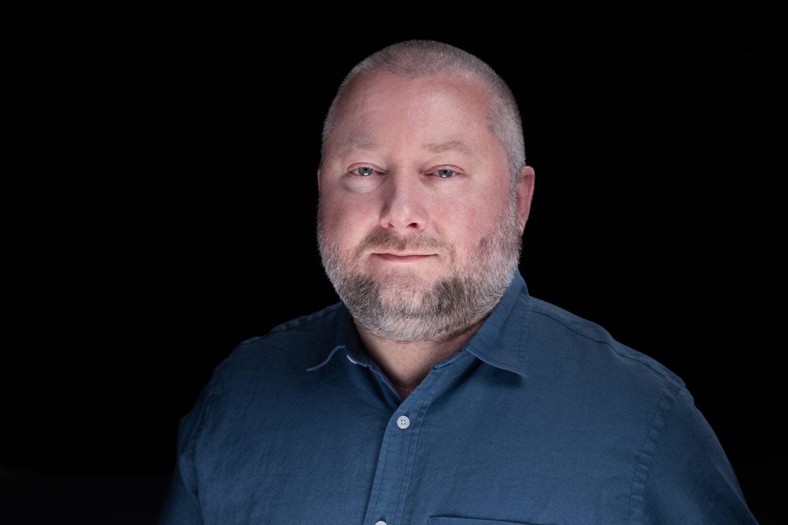 Picture shows a professional headshot of Chris Holmes, Department Head for College for Arts and Technology’s Audio Engineering & Production Department.  