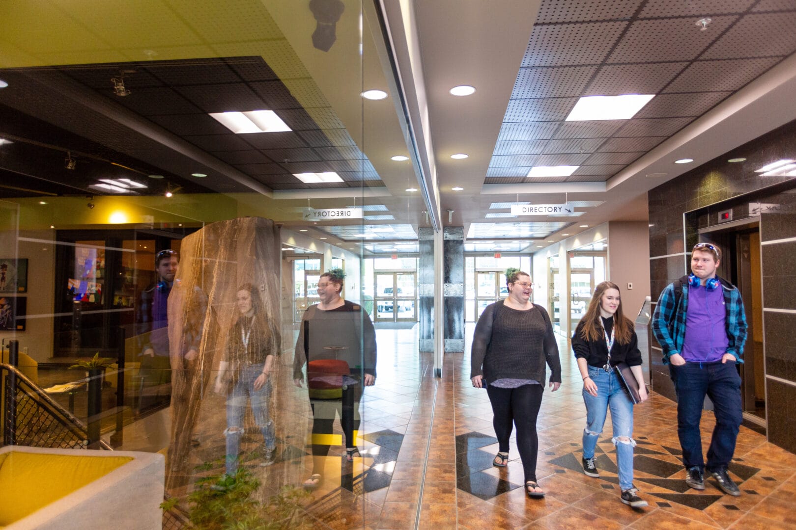 College for Arts and Technology students walking through the hallway to campus.  