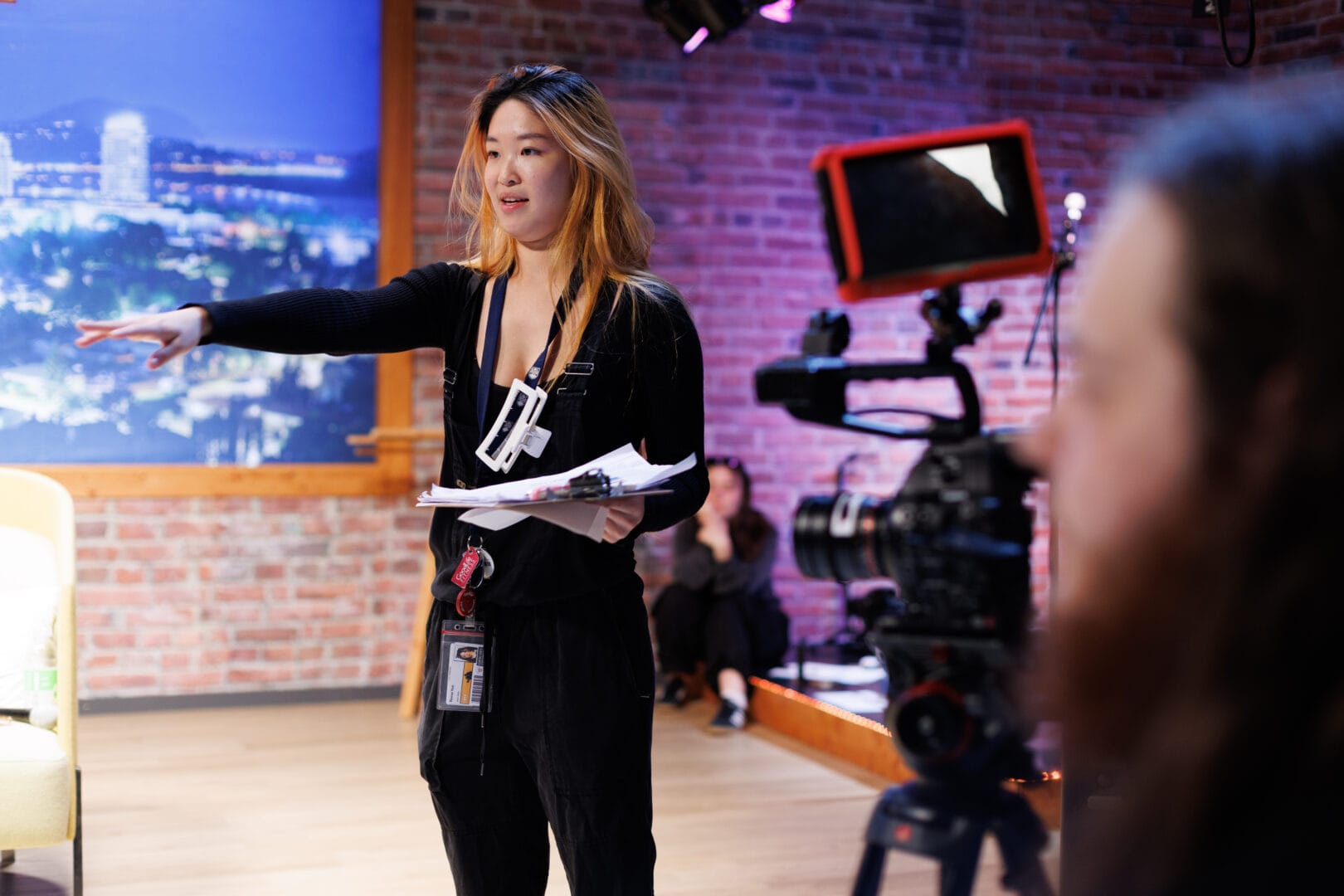 Student in a Director position on the set of a talk show produced and shot on campus in College for Arts and Technology’s production studio in Kelowna BC 