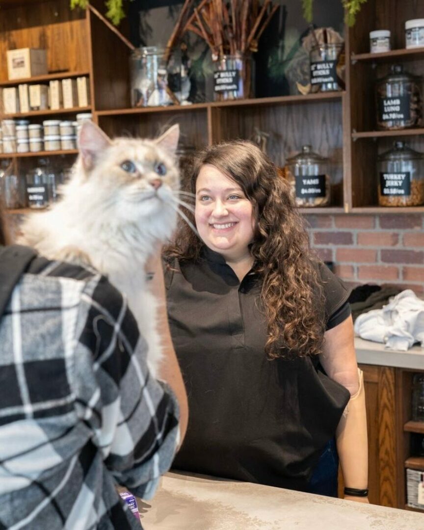 Veterinary Technician Assistant Graduate, Alexandra Starker smiling at the Pandosy Village Veterinary Hospital.